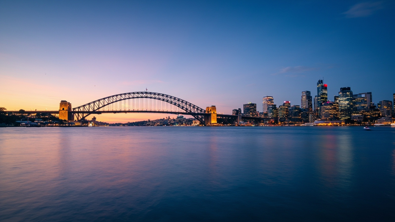 Sydney city skyline at dusk with harbor bridge